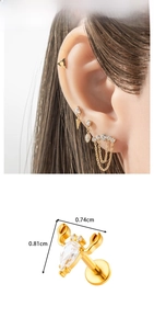 Detailed view of crab-shaped titanium labret with pear-cut zircon and thread size markings