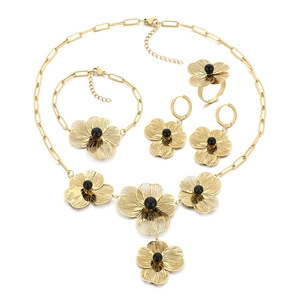 Vintage hollow flower jewelry set in gold finish with black beads and 3D floral details