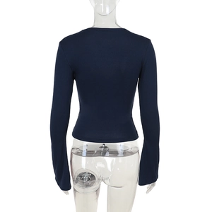 Back view of slim fit navy blue long sleeve top with lace trim on a mannequin
