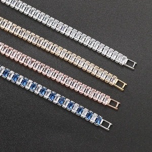 Detailed macro view of baguette-cut zircon tennis bracelets in silver, gold, and rose gold finishes