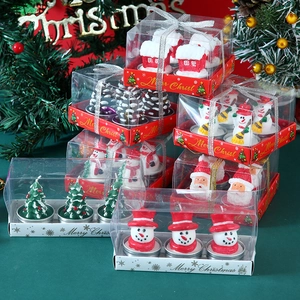 Christmas candle gift set with Santa Claus and snowman shapes in festive packaging