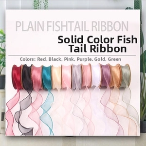 Detail showing 12 colors of plain fishtail wave ribbons for floral gift wrapping