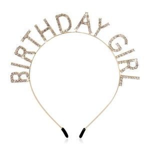 Close-up of golden metal Birthday Girl headband featuring sparkling clear rhinestones
