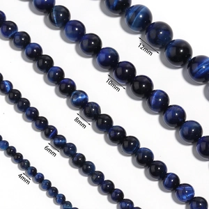 Blue tiger eye beads in 4mm to 12mm sizes showing natural chatoyancy and smooth texture