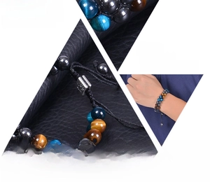 Macro detail of triple protection bracelet with tiger eye, hematite and obsidian stones