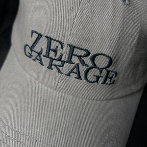 Light gray cotton twill baseball cap with navy blue Zero Garage letter embroidery