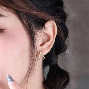 Minimalist S925 sterling silver V-shape stud earrings with zircons on model's ear