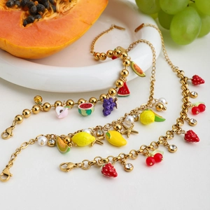 Layered 18K gold-plated fruit charm bracelet featuring pearls and colorful pendants