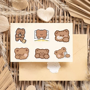 Detailed view of six cute brown bear stickers for scrapbooking and DIY decoration