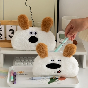 Close-up of white plush cartoon dog pencil cases with embroidered facial expressions