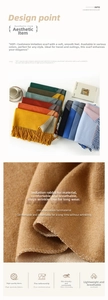 Detailed view of soft double-sided faux rabbit fur scarf with decorative tassels