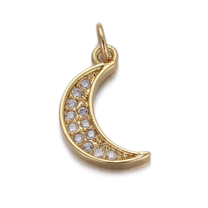 Detail of gold crescent moon pendant with inlaid zircons and shimmering star charms