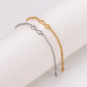 Minimalist infinity symbol bead chain bracelet in polished gold and silver finishes