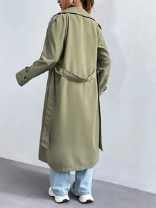 Olive green double-breasted trench coat with waist tie and loose fit for women