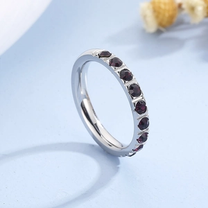 Detailed side view of 3mm silver titanium ring with purple cubic zirconia stones