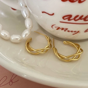 Elegant 925 sterling silver gold-plated twisted hoop earrings in minimalist style