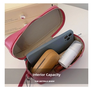 Pink minimalist crossbody bag internal view showing storage for phone and accessories