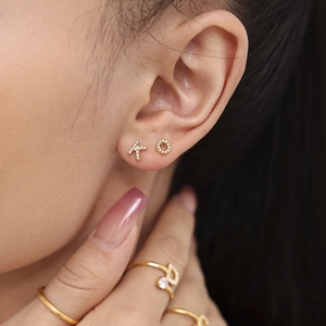 Gold PVD titanium steel earrings set with zircon initial letters K and O design