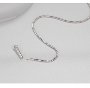 Macro shot of silver keel chain with a detailed spiral screw clasp for necklaces