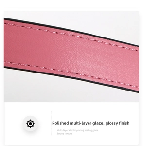 Macro shot of pink leather bag strap with multi-layer electroplating and glossy finish
