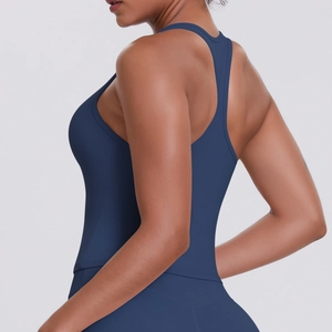Close-up of racerback design on women's navy matte compression sports tank top