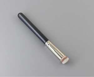 Close-up of dense synthetic bristles and silver ferrule of the professional foundation brush