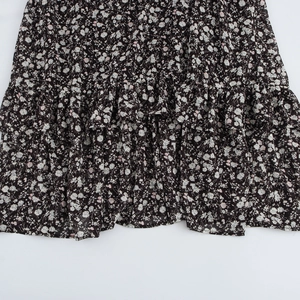 Elegant black floral dress with multilayered ruffled hemline and lightweight fabric