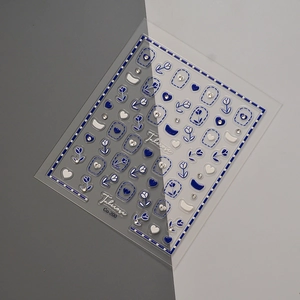 Blue tulip and white heart embossed nail art stickers with crystal accents by Tuberose