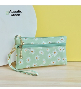 Detail of seaweed green wristlet clutch with daisy print and double gold zippers