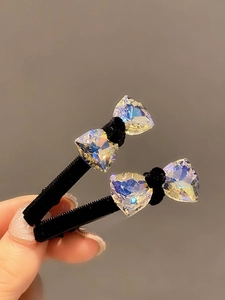 Elegant black velvet hair clip set with sparkling iridescent crystals and soft bow design