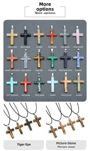 Macro detail of natural gemstone cross pendants in diverse materials with silver metal bails