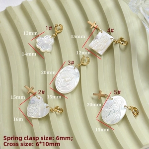 Detail view of MOP heart and shell pendants with gold spring clasps and dimensions