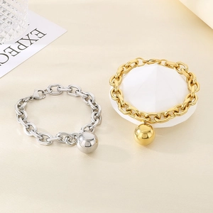 Fashionable thick chain bracelet with ball pendant in polished gold and silver finishes