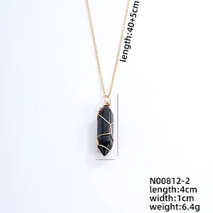 Detail view of hexagonal black stone pendant with dimensions 4cm x 1cm and 45cm chain