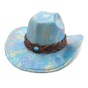 Detailed macro view of colorful scales texture on blue cowboy hat with turquoise detail