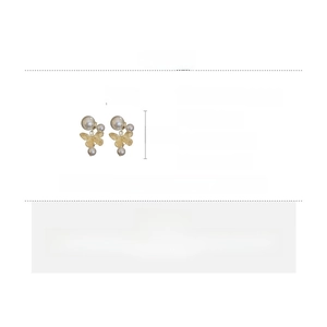 Detailed view of golden butterfly pearl earrings with size dimensions and specs