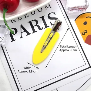 Macro detail of 6cm yellow no-bend hair clip showing dimensions and smooth metal finish