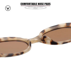 Detailed close-up of comfortable integrated nose pads on tortoiseshell oval sunglasses
