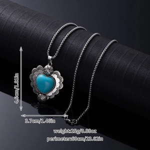 Detail of silver heart turquoise pendant with dimensions 4.6cm height and 3.7cm width