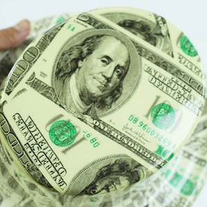 Macro shot of high-quality US dollar bill print on a stylish novelty party top hat