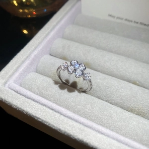 Macro shot of clover ring with sparkling cubic zirconia on a velvet jewelry box