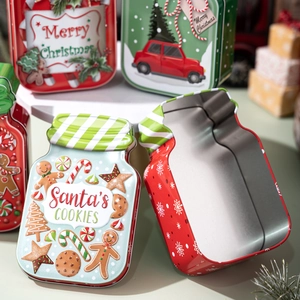 Christmas tin canisters with Merry Christmas prints and Santa's cookies embossed designs