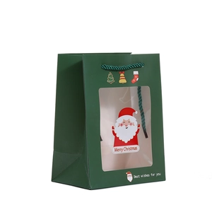 Dark green Christmas paper gift bag with transparent window and woven handle
