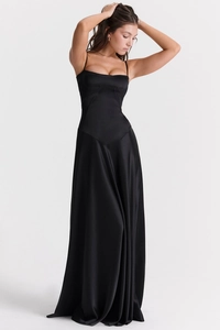Detail of elegant black satin evening dress showing the slim fit and fine shoulder straps