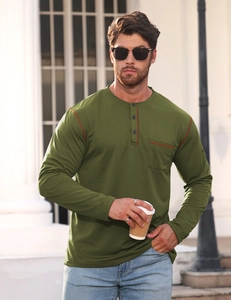 Detail of olive green henley shirt with orange contrast stitching and three-button neckline