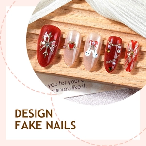 Press-on nails featuring festive red bows, 3D heart gems, and cute rabbit hand-painted art
