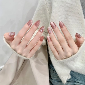 Handmade cat eye press-on nails in dusty rose with white rose floral patterns