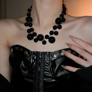 Exaggerated black irregular pearl necklace featuring bold tiered beads for women