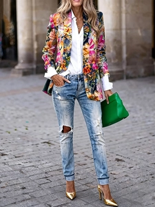 Slim fit colorful floral print blazer for women styled with ripped blue denim jeans
