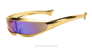 Detail of futuristic Y2K sunglasses with golden metal frame and purple gradient lenses